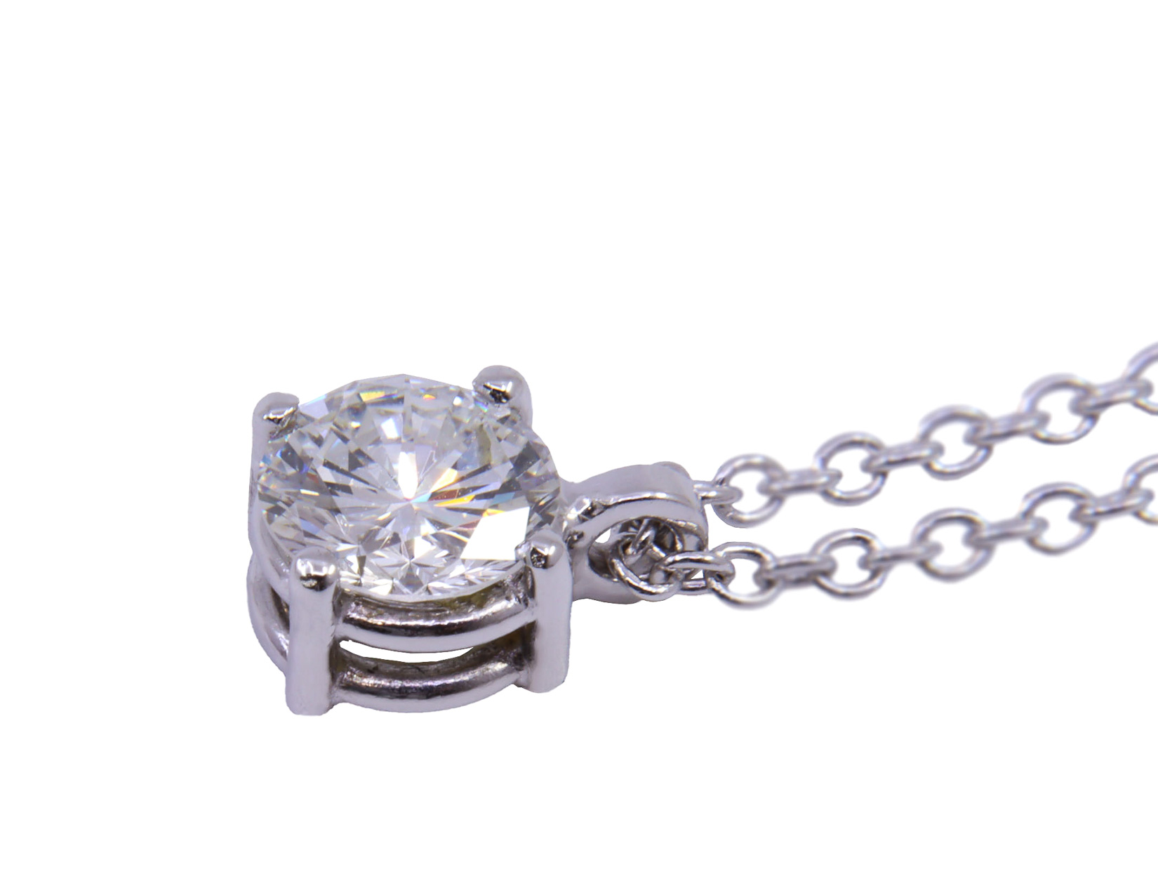 Collana modello punto luce in oro bianco a titolo 750/°°° di grammi2.60 con un diamante naturale di carati 0.45