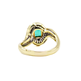Anello in oro giallo 18 carati  di grammi 8.20 con uno smeraldo e dei piccoli diamantini